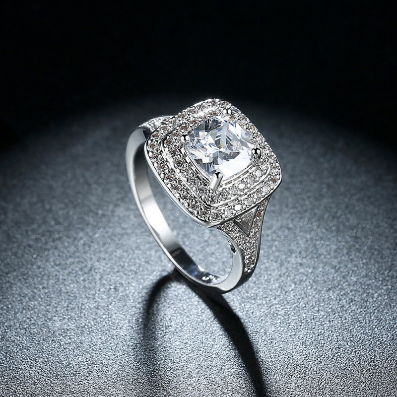 BRASS RING WITH ZIRCON STONE